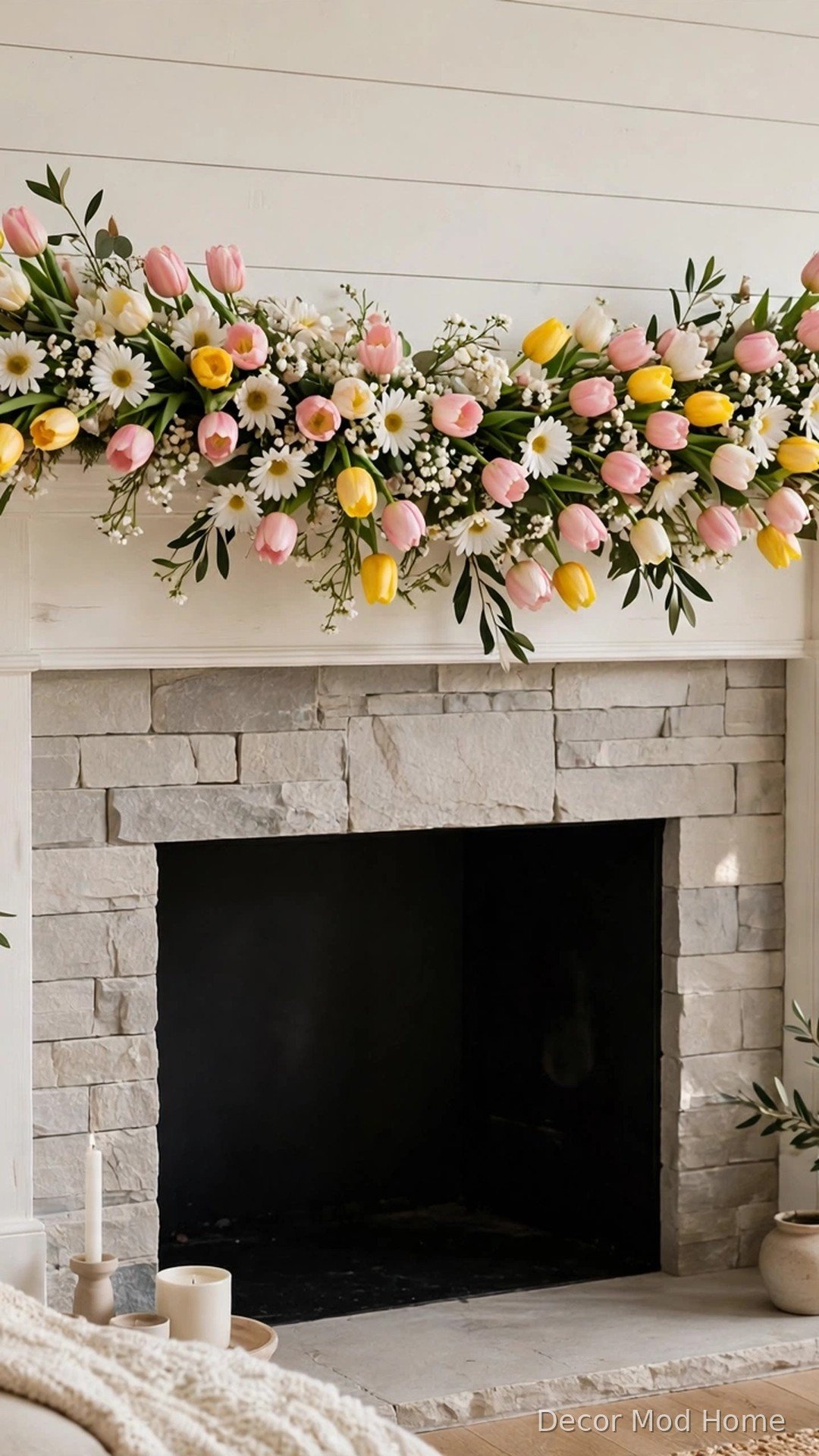 Cascading tulip and daisy garland draped over a spring fireplace mantel